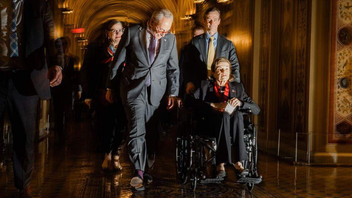 Sen. Dianne Feinstein, D-Calif., is escorted by Senate Majority Leader Chuck Schumer, D-N.Y., into the Senate side of the the U.S. Capitol on Wednesday in Washington, D.C. Feinstein’s return to Congress bookends a more than two-month absence from the nation’s Capitol due to illness.