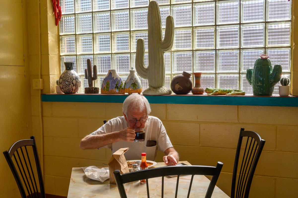 A customer sips coffee amid the southwestern decor inside Nopalitos in East Sacramento on Tuesday, Oct. 2, 2019.