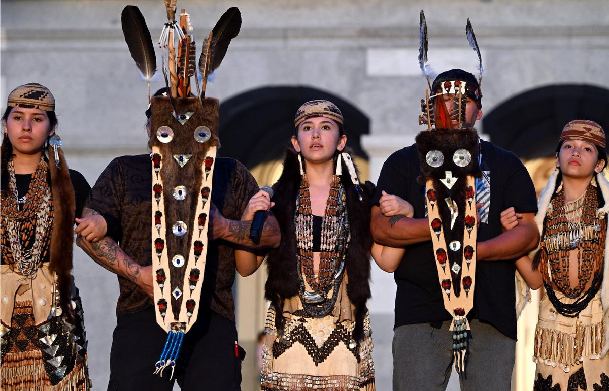 Members of the Yurok Tribe including sisters Jone-deh Hostler, 14, left, and Brycee Hostler, 15, center, gather for a Brush Dance in front of the Capitol on May 1 during an event to bring awareness to missing and murdered indigenous people.
