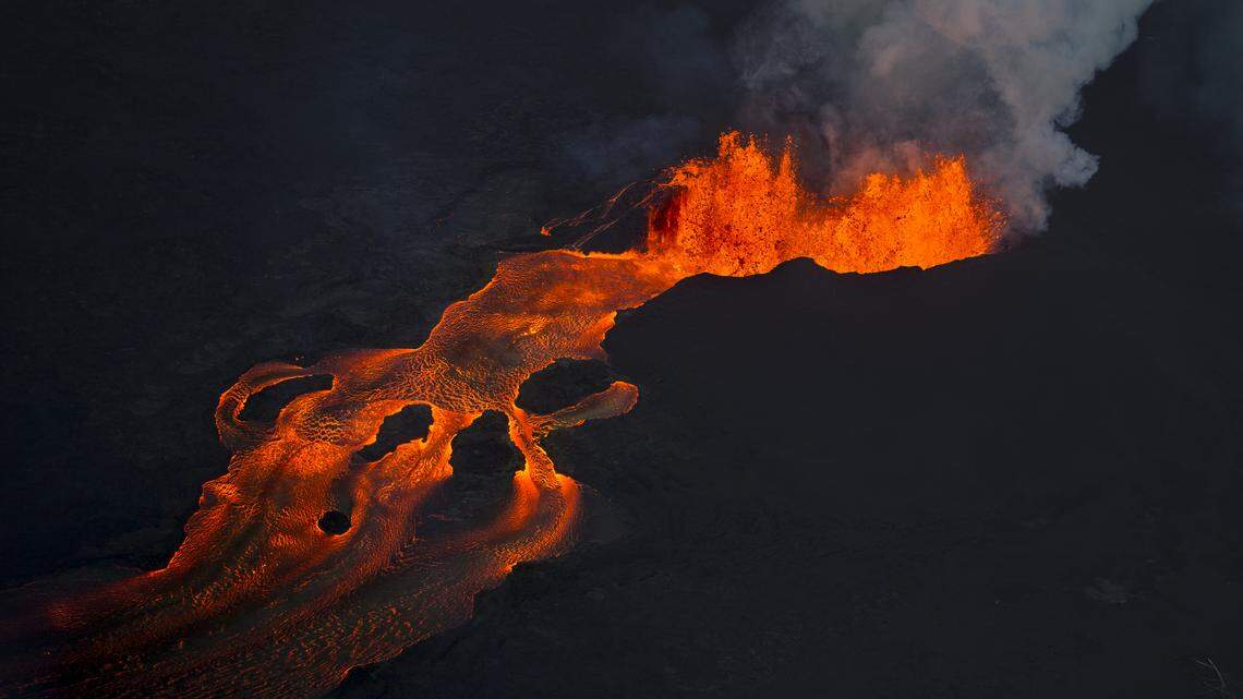 Lava from the Kilauea volcano continues to erupt from a fissure and forms a river of lava flowing down to Kapoho on Sunday, June 10, 2018, in Pahoa, Hawaii.