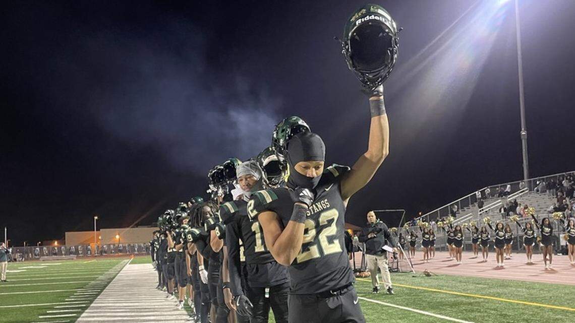 The Monterey Trail Mustangs stand before their CIF Sac-Joaquin Section playoff game Friday, hosting Lincoln of Stockton at Monterey Trail High School in Elk Grove.