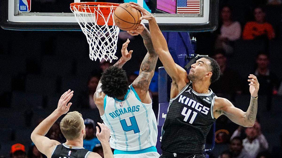 Sacramento Kings forward Trey Lyles (41) blocks a shot by Charlotte Hornets center Nick Richards (4) during the second half of an NBA basketball game Monday, Oct. 31, 2022, in Charlotte, N.C. (AP Photo/Rusty Jones)