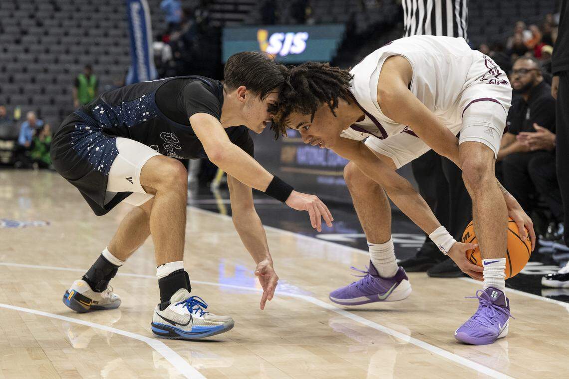 Natomas Nighthawks’ Diego Villanueva faces off with Venture Academy’s Delonnie Bague during the CIF Sac-Joaquin Section Division IV boys basketball championship at Golden 1 Center in Sacramento on Friday.