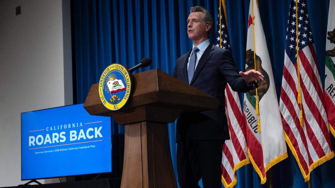 California Gov. Gavin Newsom delivers his revised May budget proposal at a press conference on Friday, May 14, 2021 in Sacramento. He must announce a new plan for the 2022-23 year by Monday.