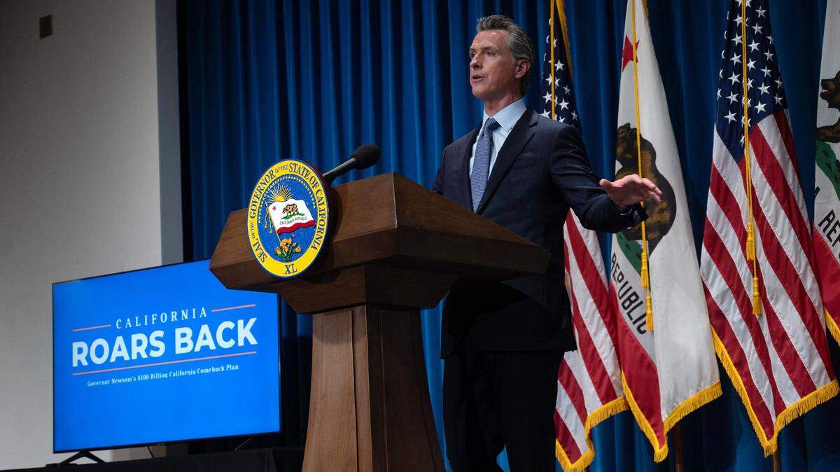 California Gov. Gavin Newsom delivers his revised May budget proposal at a press conference on Friday, May 14, 2021 in Sacramento. He must announce a new plan for the 2022-23 year by Monday.