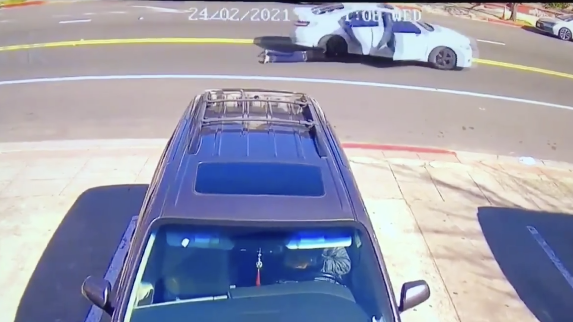 A woman visiting Oakland’s Chinatown was dragged by a car when a thief allegedly stole her purse, according to surveillance video. Police are investigating.