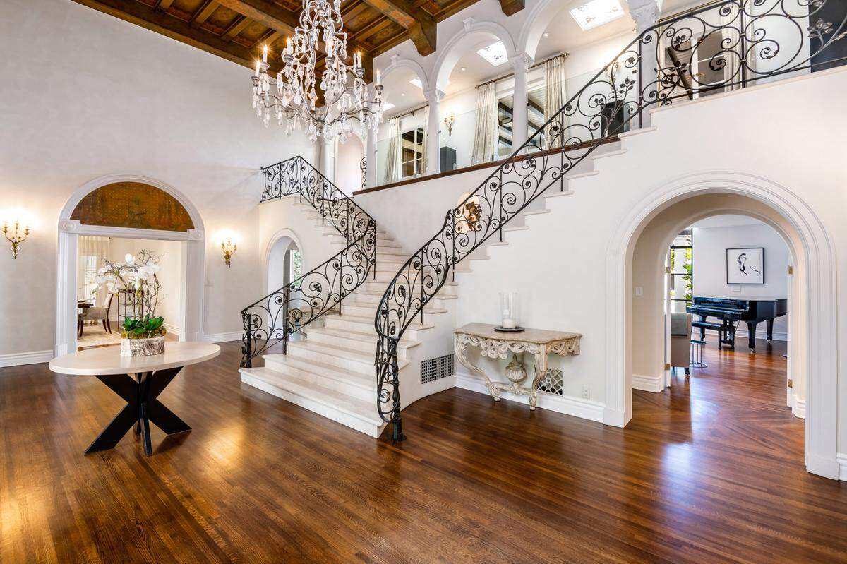 The home spans 8,700 square feet with five bedrooms and eight bathrooms.