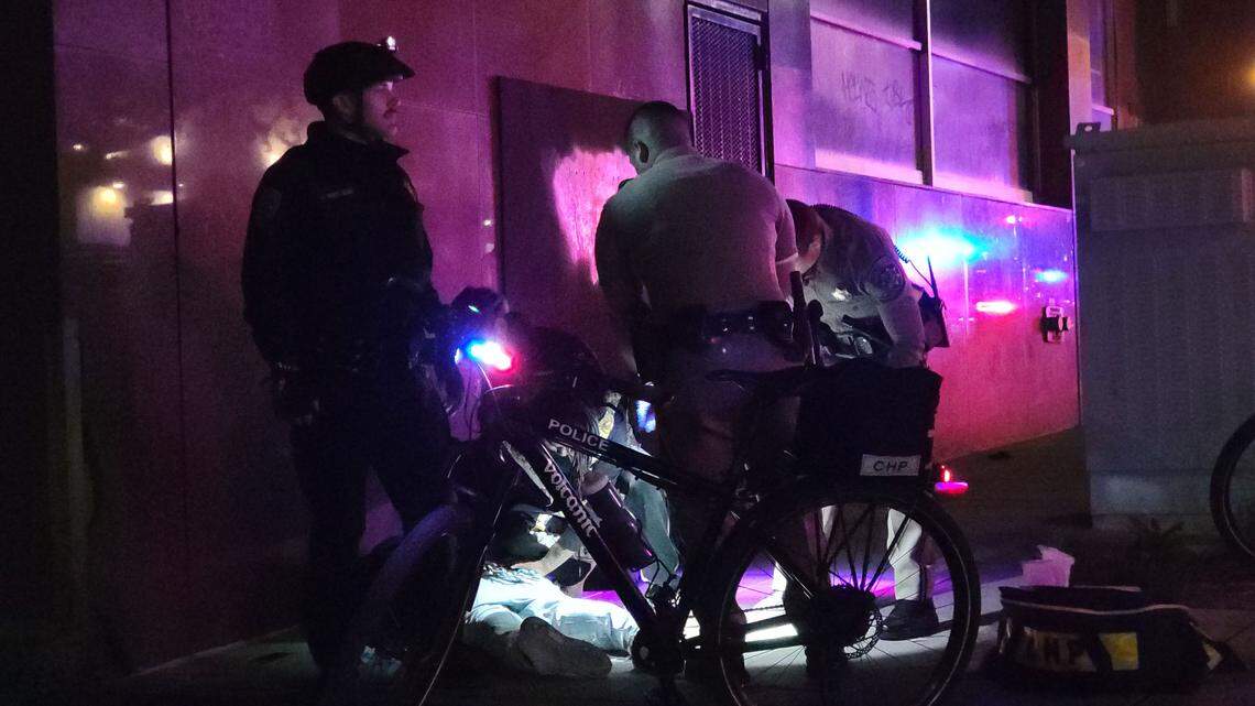 First responders treat a victim at the scene of a mass shooting in downtown Sacramento on Sunday.