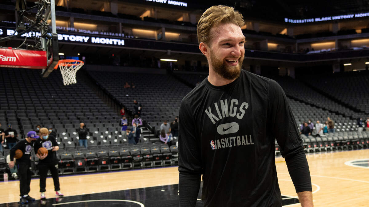 Sacramento Kings center Domantas Sabonis (10) is greeted by play-by-play announcer Mark Jones before a game at Golden 1 Center on Wednesday, Feb. 9, 2022 in Sacramento.