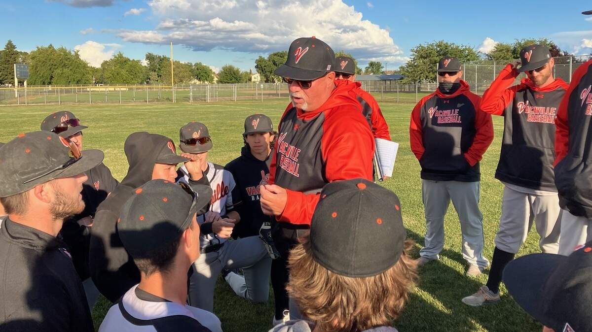 Vacaville coach Stu Clary hands out keys after the Bulldogs won a playoff game on Tuesday, May 10, 2022.