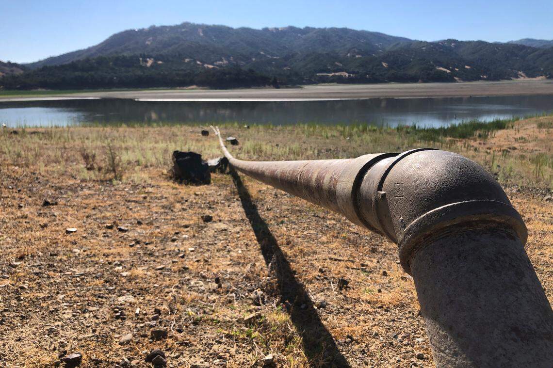 A pipe runs to Lake Mendocino near Ukiah on Aug. 4. Tourists flock to the picturesque coastal town of Mendocino for its Victorian homes and cliff trails, but visitors this summer will also find public portable toilets and dozens of signs on picket fences announcing the quaint Northern California hamlet: “Severe Drought Please conserve water.” The town of Mendocino gets some of their water from the reservoir, but most of the lake water goes to Sonoma County.