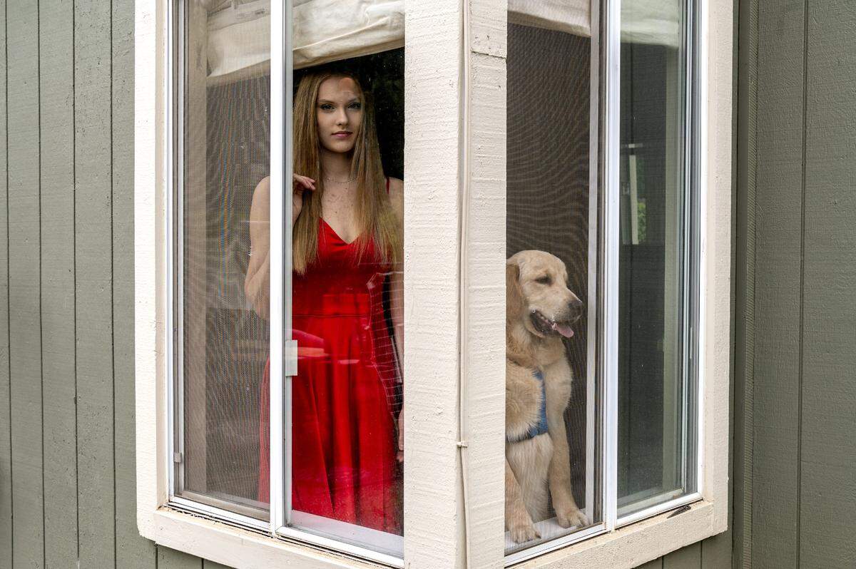 Riley Flynn, 16, of Rocklin, was posing in her prom dress when her dog Barley decided to join in on Wednesday, March 18, 2020. Flynn, a junior at Rocklin High School, joins many high schoolers who are disappointed to miss the life experience at the prom as all events have been canceled due to the coronavirus for the remainder of the school year.