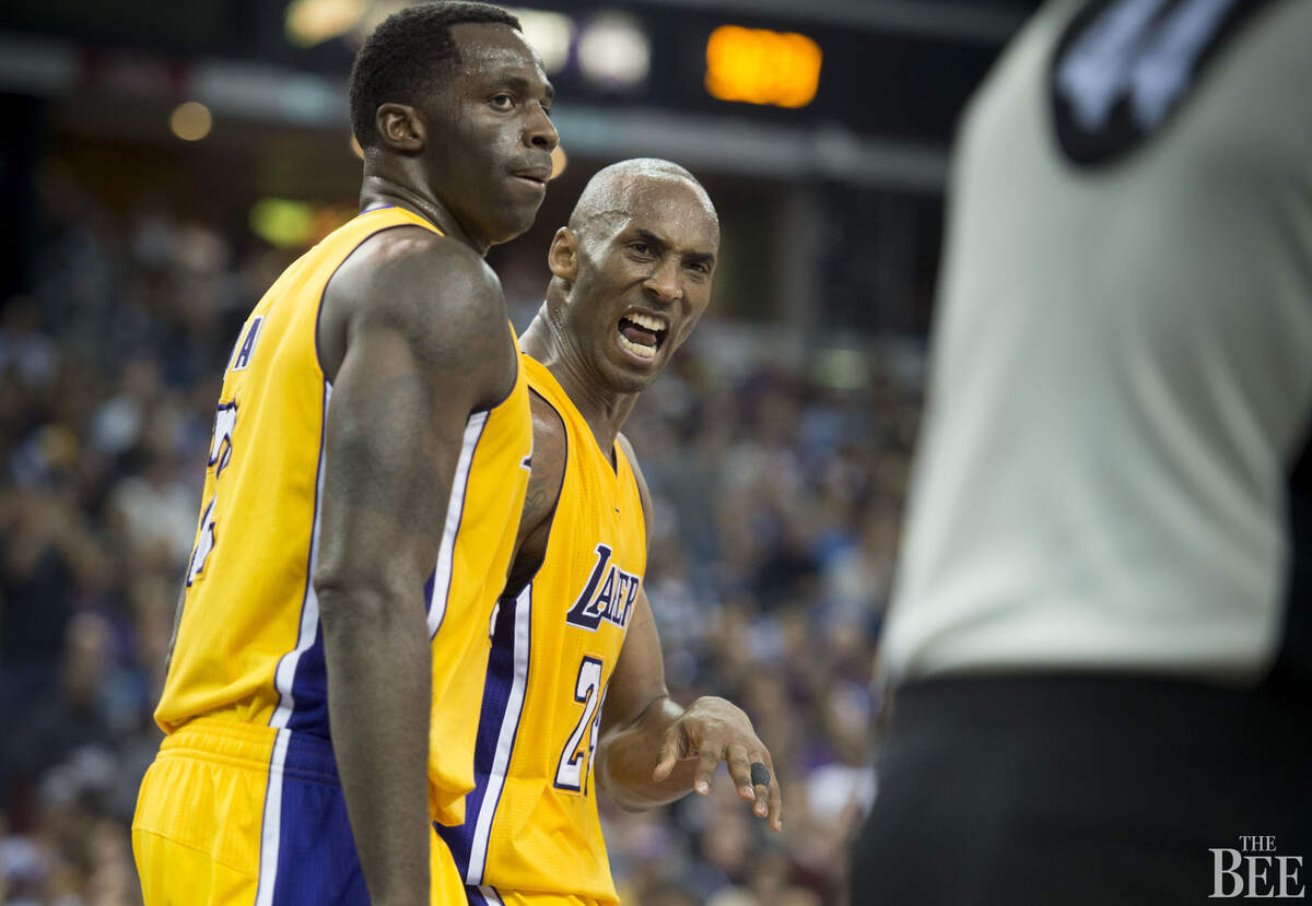 Los Angeles Lakers forward Kobe Bryant (24) makes himself heard by referee Eli Roe (44) after he felt he was fouled by Sacramento Kings center Kosta Koufos (41) on his final play in the fourth quarter.