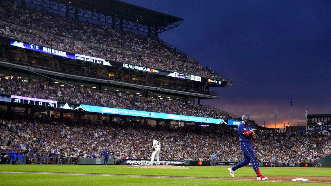 National League’s Mark Melancon, of the San Diego Padres, stands on the mound after walking American League’s Joey Gallo, of the Texas Rangers, right, during the eighth inning of the MLB All-Star baseball game, Tuesday, July 13, 2021, in Denver. (AP Photo/David Zalubowski)