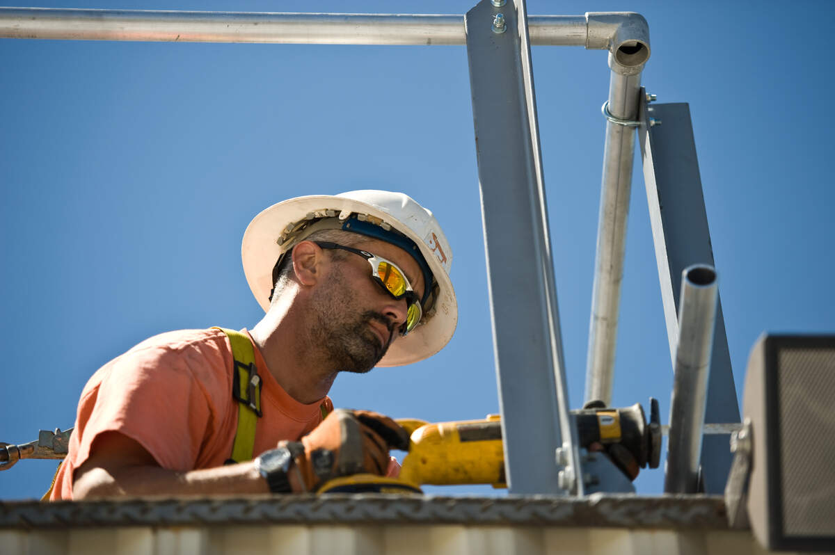 Construction worker Eric Russo widens a viewing area, known as the crow’s nest, to accommodate ESPN cameras Aug. 26, 2010, in preparation for a season-opening high school football game between Folsom and Grant. The teams will open the 2025 season against each other.
