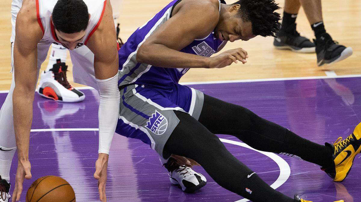Sacramento Kings center Hassan Whiteside (20) and Portland Trail Blazers center Enes Kanter (11) battle for the ball in the third quarter during a game at Golden 1 Center on Wednesday, Jan. 13, 2021 in Sacramento.