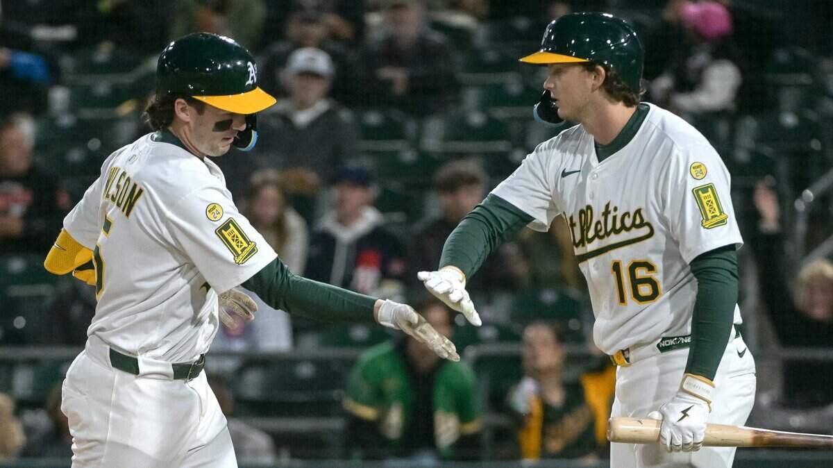 Apr 25, 2025; West Sacramento, California, USA; Athletics shortstop Jacob Wilson (5) celebrates with first baseman Nick Kurtz (16) after hitting a home run against the Chicago White Sox during the fifth inning at Sutter Health Park. Mandatory Credit: Ed Szczepanski-Imagn Images
