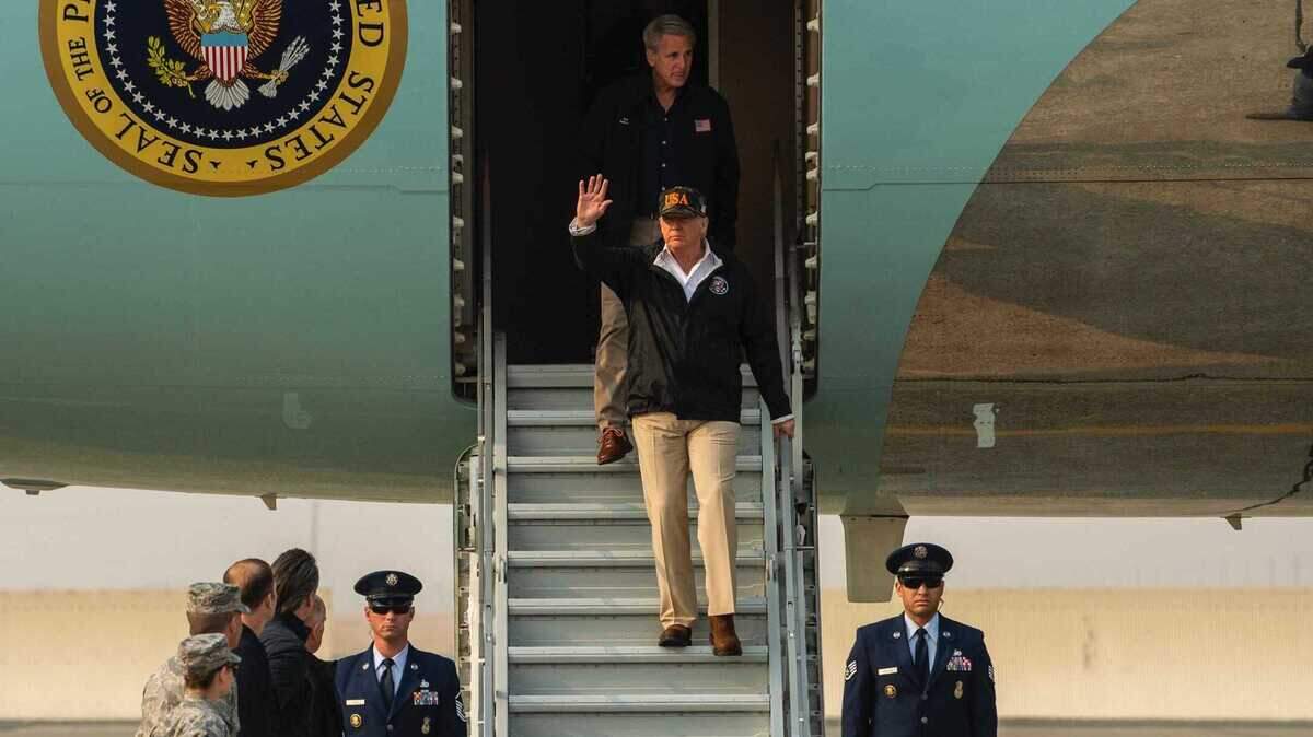 President Donald Trump walks down the steps of Air Force One at Beale Air Force Base in November 2018 to tour damage from the Camp Fire. Trump will be visiting Sacramento County on Monday, Sept. 14, 2020, to be briefed on the deadly wildfires that have charred more than 3 million acres across the state.