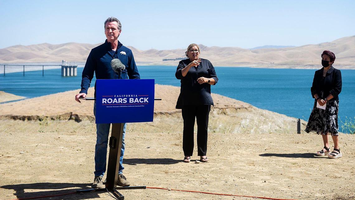 California Gov. Gavin Newsom, left, speaks during a news conference where he announced a proposal of a $5.1 billion investment for drought preparedness, infrastructure and response to ensure a more climate resilient system, at the San Luis Reservoir Romero Visitor Center in Merced County, Calif, on Monday, May 10, 2021.