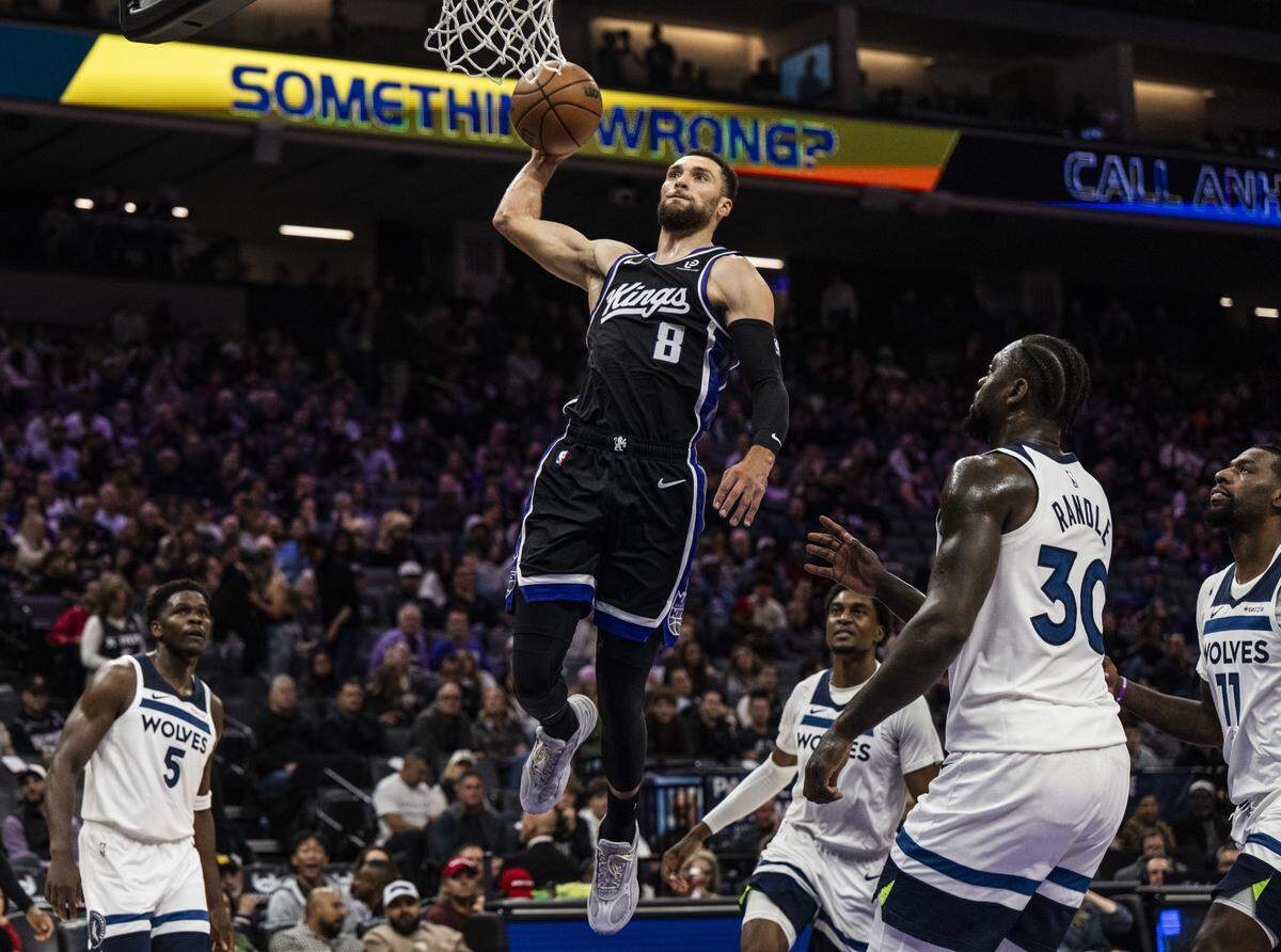 Sacramento Kings guard Zach LaVine (8) makes a dunk against the Minnesota Timberwolves during an NBA game at Golden 1 Center on Monday.