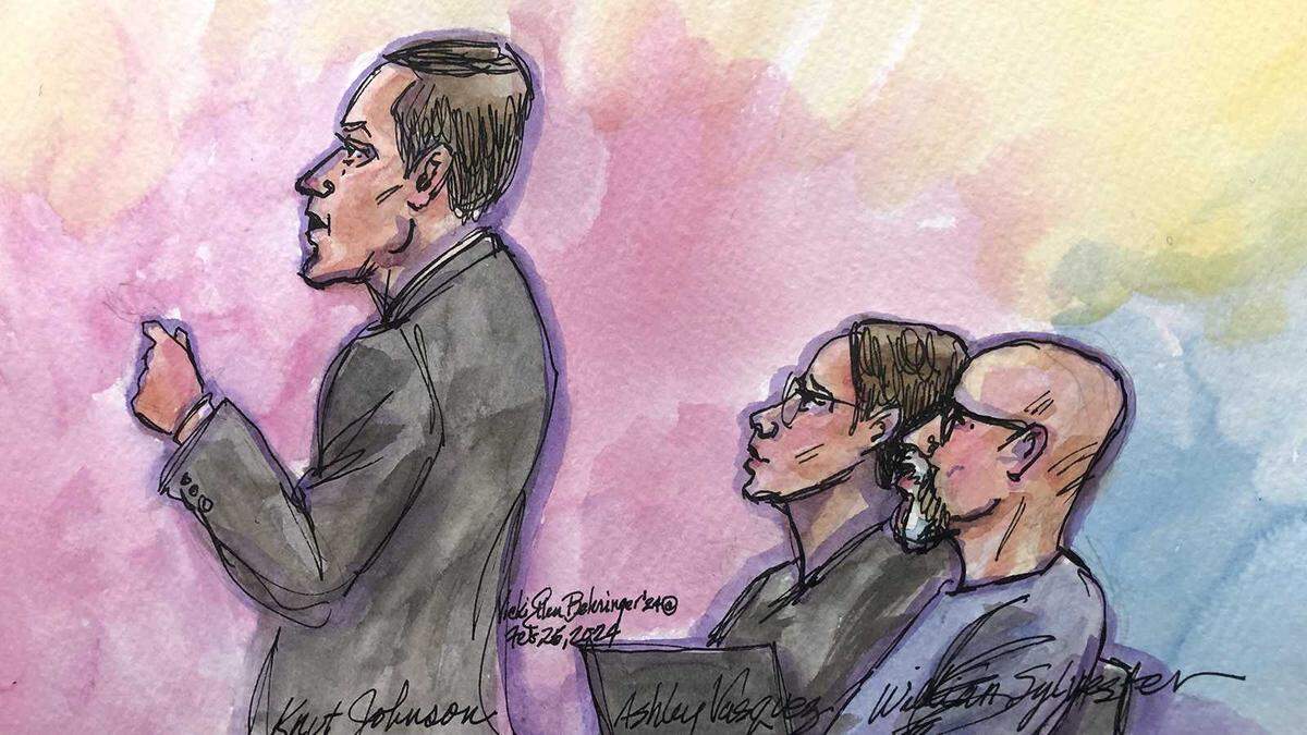 Attorney Knut Johnson, left, gives opening statements on behalf of his client, William Sylvester, right, during the opening of a federal trial Monday, Feb. 26, 2024, in Sacramento. Federal prosecutors have charged three leaders of California’s Aryan Brotherhood prison gang with racketeering, murder and drug peddling.