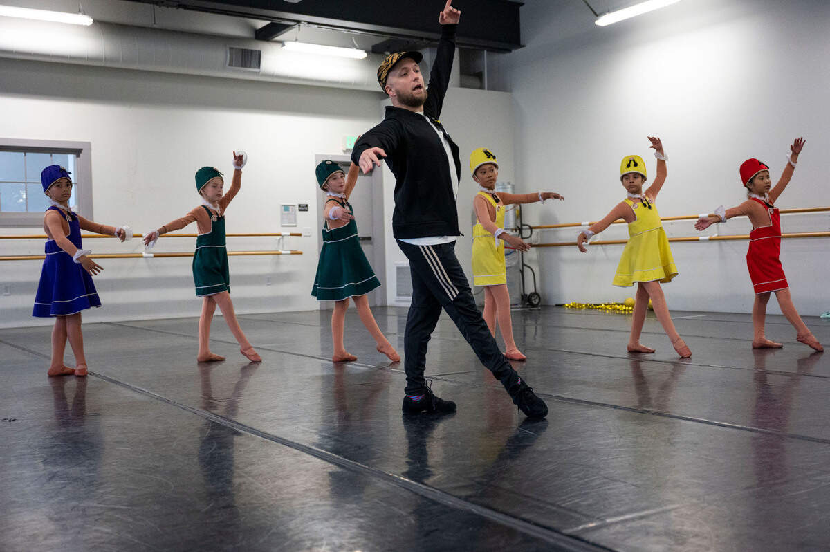 Sacramento Ballet rehearsal director Colby Damon works with youth cast members playing Mother Ginger’s Children during a rehearsal in costume for "The Nutcracker" at the Sacramento Ballet studio earlier this month. 