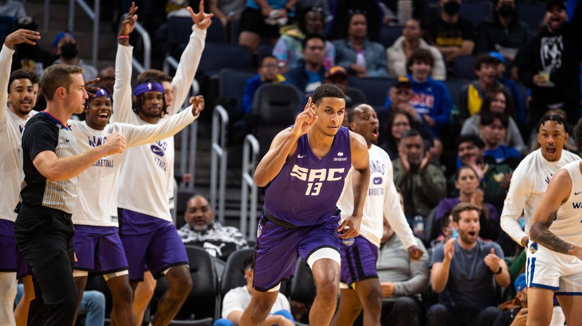 Sacramento Kings forward Keegan Murray (13) is cheered by teammates and fans after sinking the first three point basket — and his first score for the Kings — in the early moments of the first period against the Golden State Warriors during the California Classic NBA preseason basketball game Saturday, July 2, 2022, at Chase Center in San Francisco.