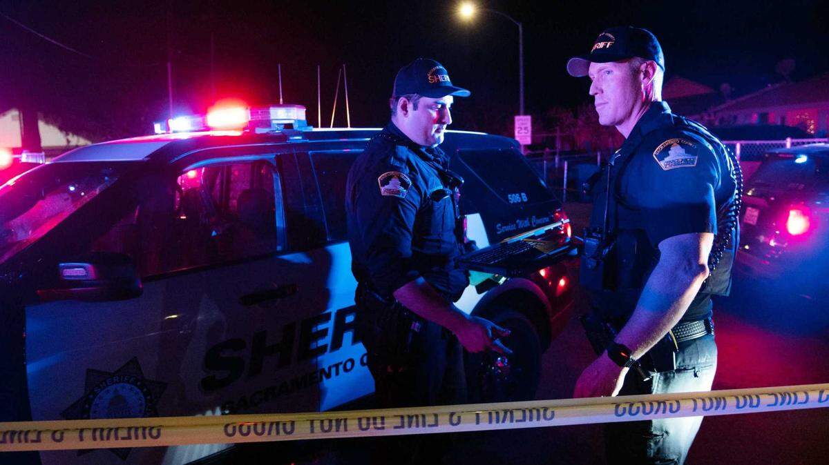Sacramento County sheriff’s deputies investigate a shooting in 2022. The Sheriff’s Office says deputies have limited their response to certain mental health-related 911 calls.