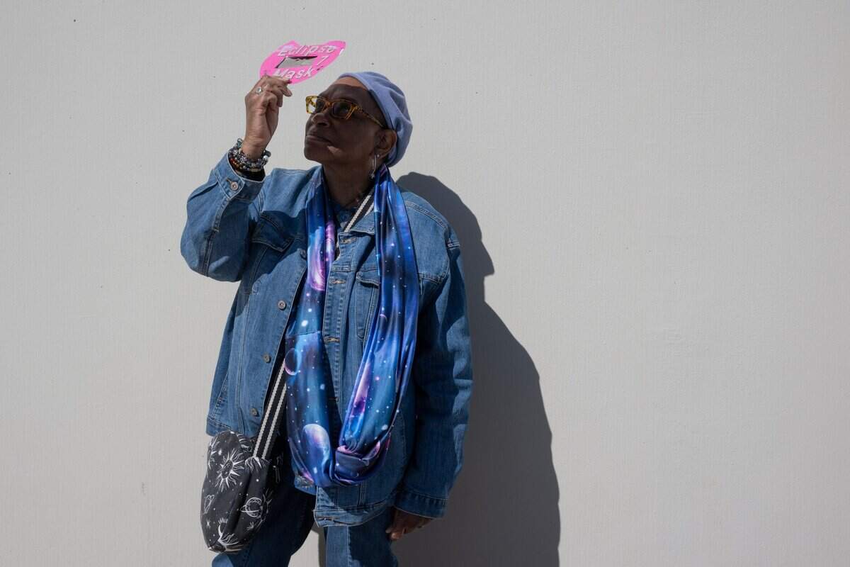 Beatrice Hogg of West Sacramento looks at the solar eclipse at the Museum of Science and Curiosity in Sacramento on Monday with a viewer she made for the 2017 eclipse. She is wearing science-inspired clothing and said she has been interested in astronomy since she was a child.