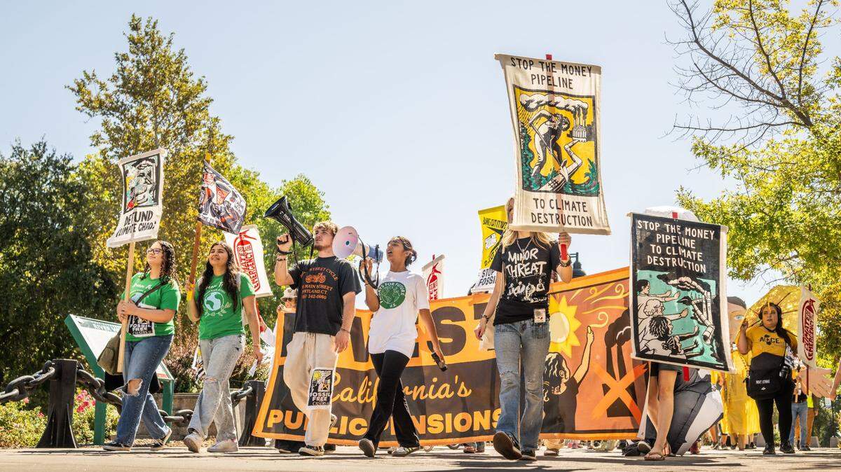 Granite Bay High School student Anushka Kalyan, 17, center, leads a march on Friday, Sept. 20, 2024, for youth climate action group Fridays for Future. The group wants the teachers’ pension fund to divest the $15 billion it has invested in fossil fuel companies.