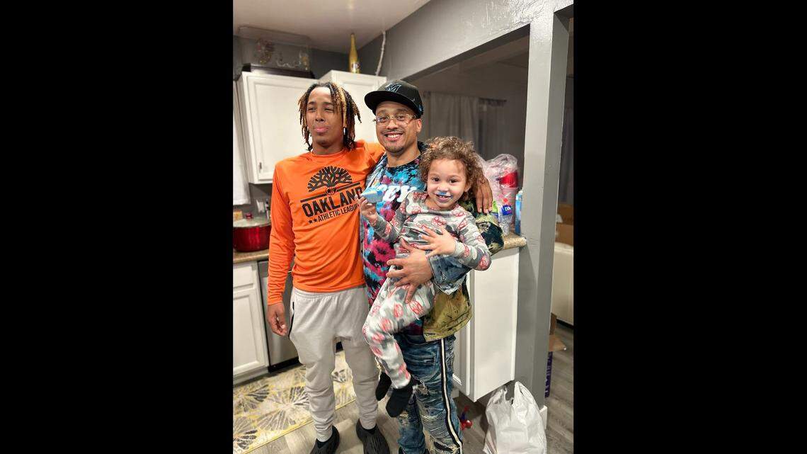 This provided photo shows Deontae Faison with his two sons.