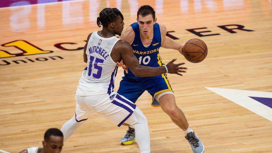 Golden State Warriors guard Justinian Jessup, right, dribbles around Sacramento Kings guard Davion Mitchell during the second half of their NBA California Classic game Tuesday at Golden 1 Center in downtown Sacramento. Jessup and former Boise State teammate Derrick Alston Jr. are both playing on the Warriors’ summer league team.