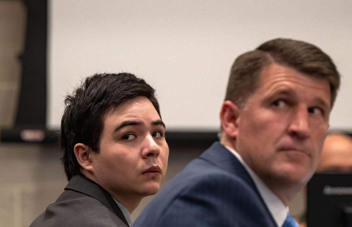 Carlos Reales Dominguez and public defender Daniel Hutchinson turn to look as Caley Gallardo, Dominguez’s former girlfriend, takes the oath before testifying in Yolo Superior Court in Woodland on May 19. Dominguez is accused of murdering two and injuring a third in a series of knife attacks in Davis.