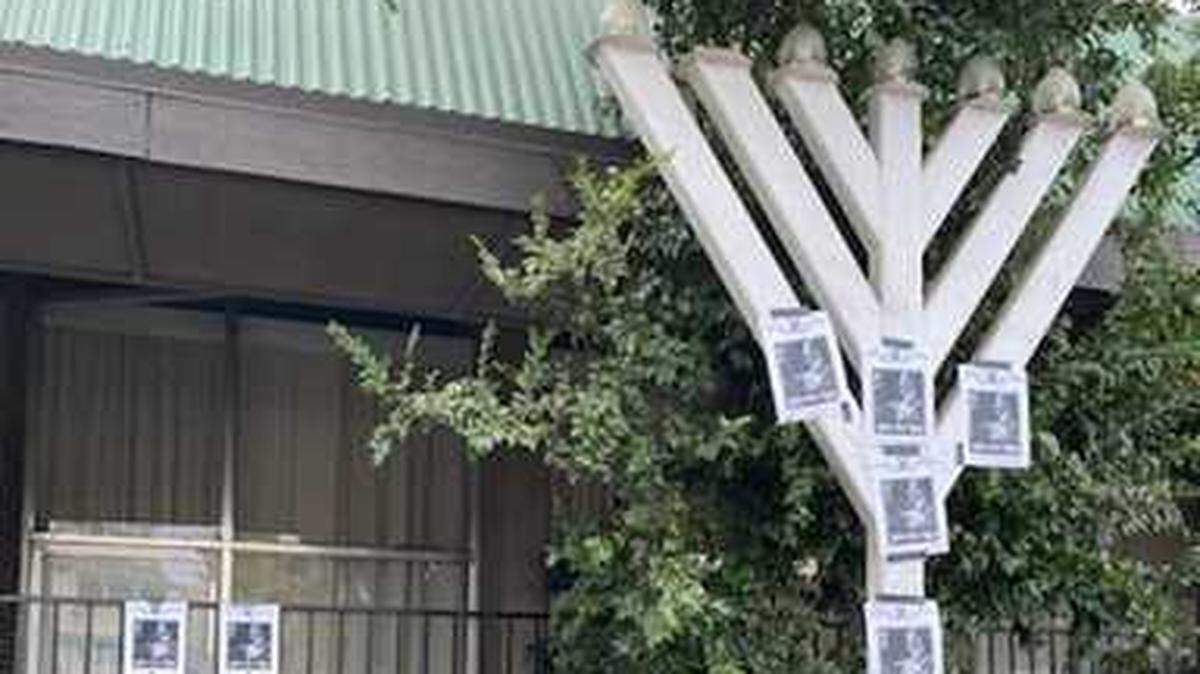 Antisemitic leaflets with pictures of Nazi leader Adolf Hitler were found Wednesday Oct. 21, 2021, taped to a menorah in front of the Shalom le Israel synagogue on Fair Oaks Boulevard in Carmichael, California.