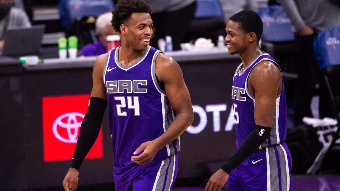 Sacramento Kings guard Buddy Hield (24), left, and guard De’Aaron Fox (5) retake the court after a timeout during the fourth period of the NBA game Sunday, Jan. 17, 2021, at Golden 1 Center in Sacramento. The Kings lost to the Pelicans 128-123.