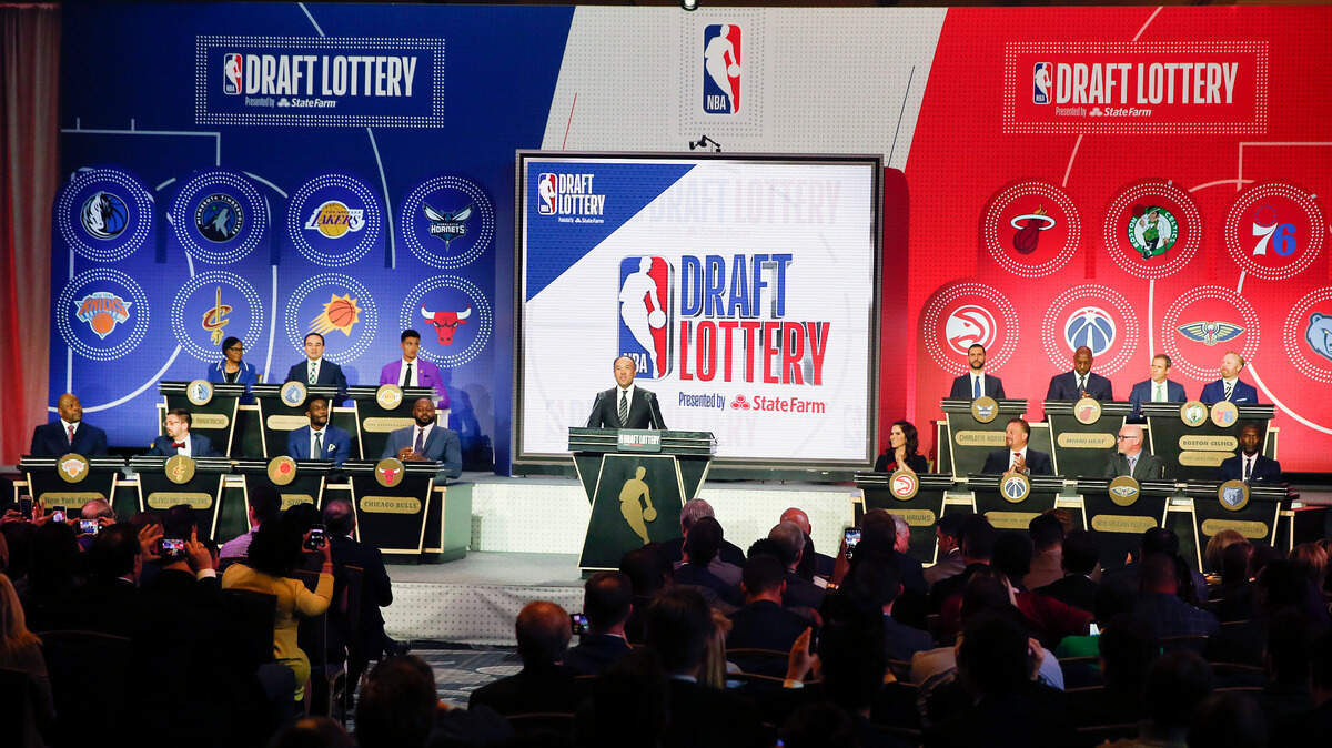 NBA Deputy Commissioner Mark Tatum gets ready to announce the order of the picks during the NBA basketball draft lottery Tuesday, May 14, 2019, in Chicago. (AP Photo/Nuccio DiNuzzo)