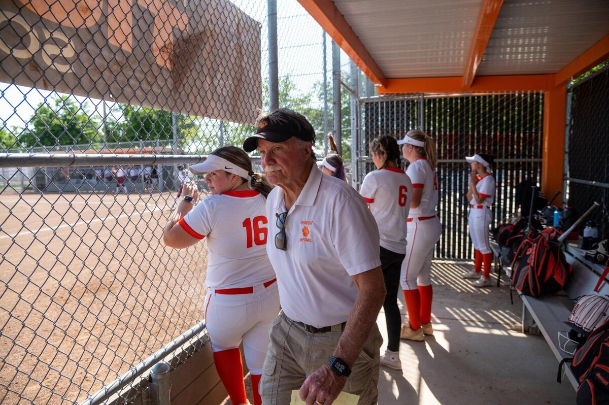Roseville High’s varsity girls softball coach Art Banks walks in the dugout before the start of the game against Woodcreek High School on Monday at Roseville High School. Banks has 753 career wins and 375 losses since starting his softball career in 1984. He’s retiring at the end of the season.