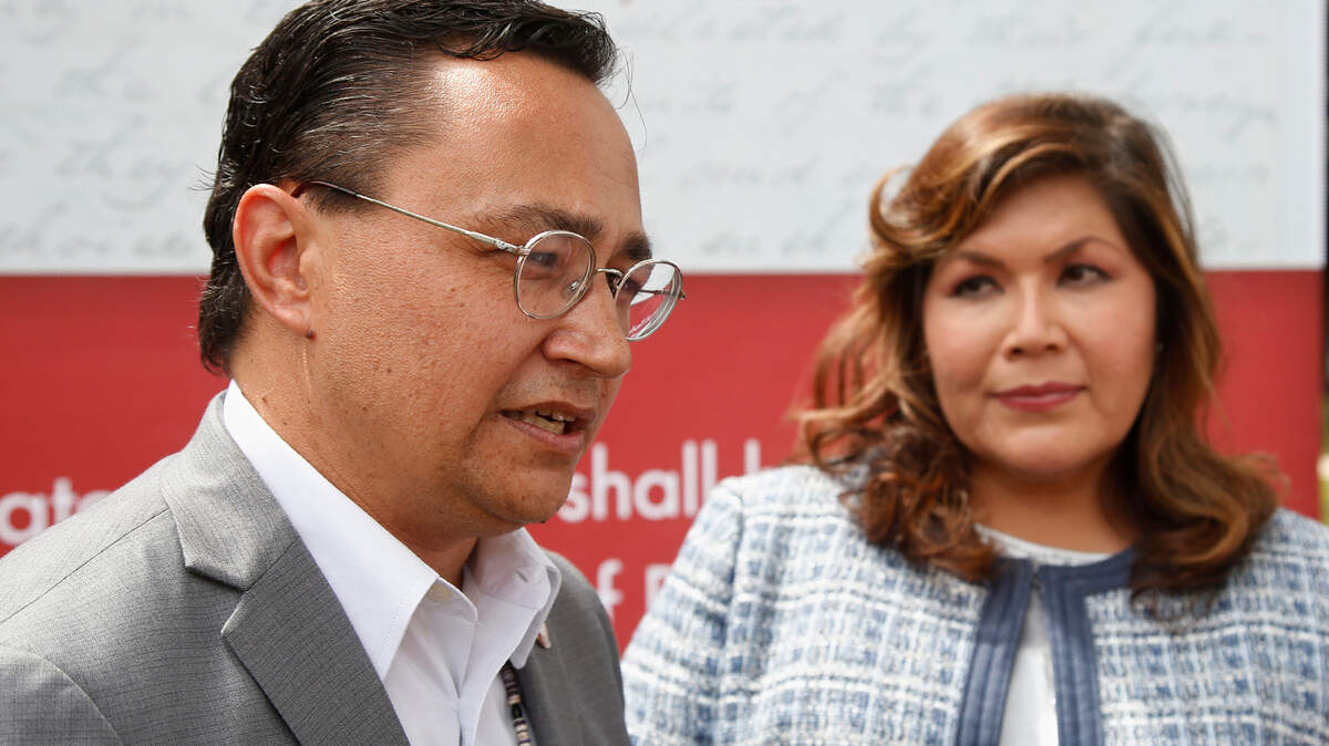 Cherokee Nation Principal Chief Chuck Hoskin Jr., left, answers a question for the media following his announcement that he is nominating Kimberly Teehee, right, as a Cherokee Nation delegate to the U.S. House, in Tahlequah, Okla., Thursday, Aug. 22, 2019. Hoskin Jr. acknowledged the first such attempt by a tribal nation will take time as well as cooperation from Congress. (AP Photo/Sue Ogrocki)