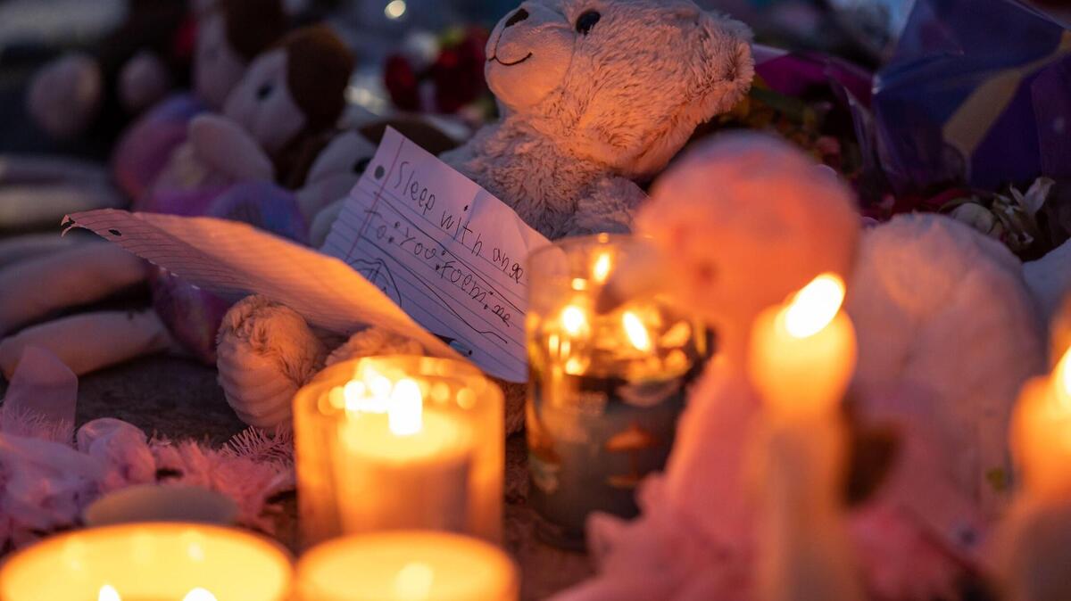 Messages and tributes are left by mourners for Samia Mora Gutierrez,13, Samantha Mora Gutierrez, 10, and Samarah Mora Gutierrez, 9, during a vigil Tuesday, March 1, 2022, outside Arden Arcade’s The Church in Sacramento. Community members held the vigil a day after the girls’ 39-year-old father shot and killed them along with chaperone Nathaniel Kong, then turned the gun on himself, inside the church on Wyda Way, authorities said.