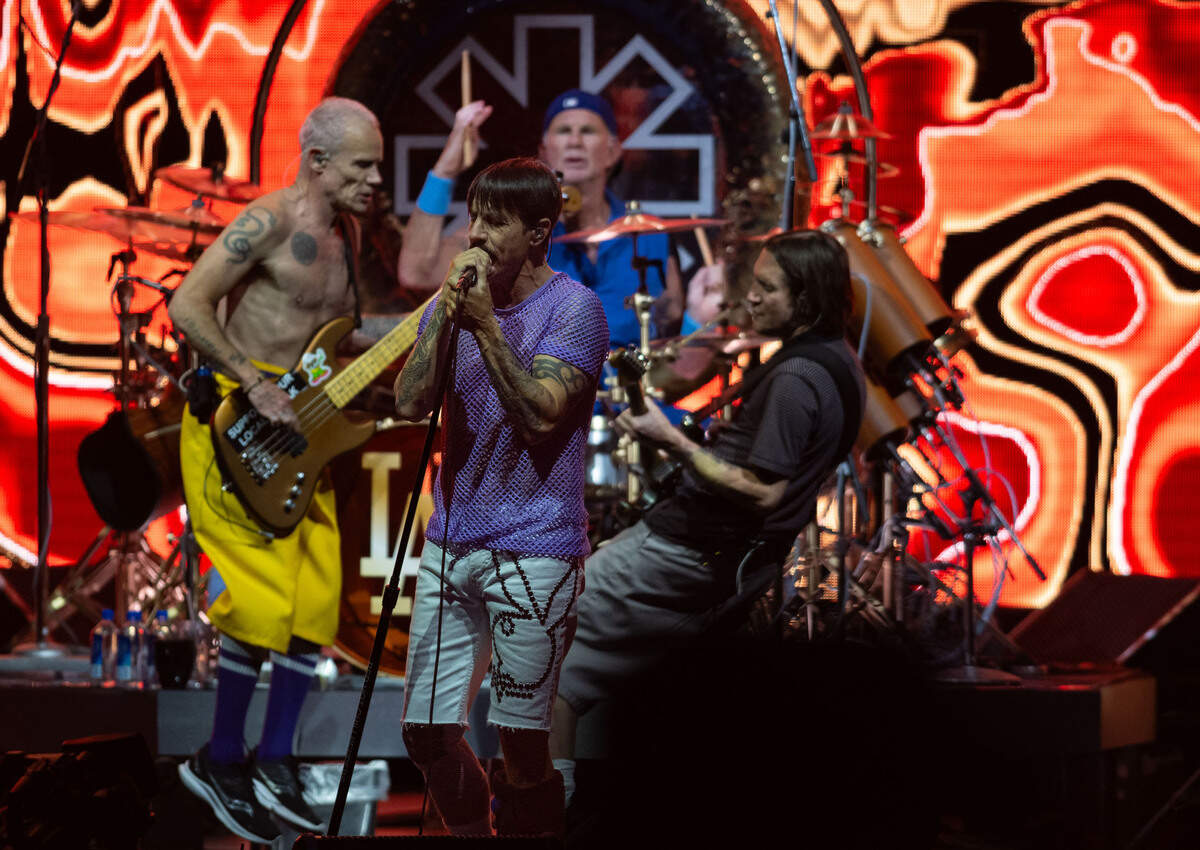 Red Hot Chili Peppers lead singer Anthony Kiedis performs with bassist Flea, left, drummer Chad Smith and guitarist John Frusciante at the Toyota Amphitheatre near Wheatland on Sunday, June 2, 2024.