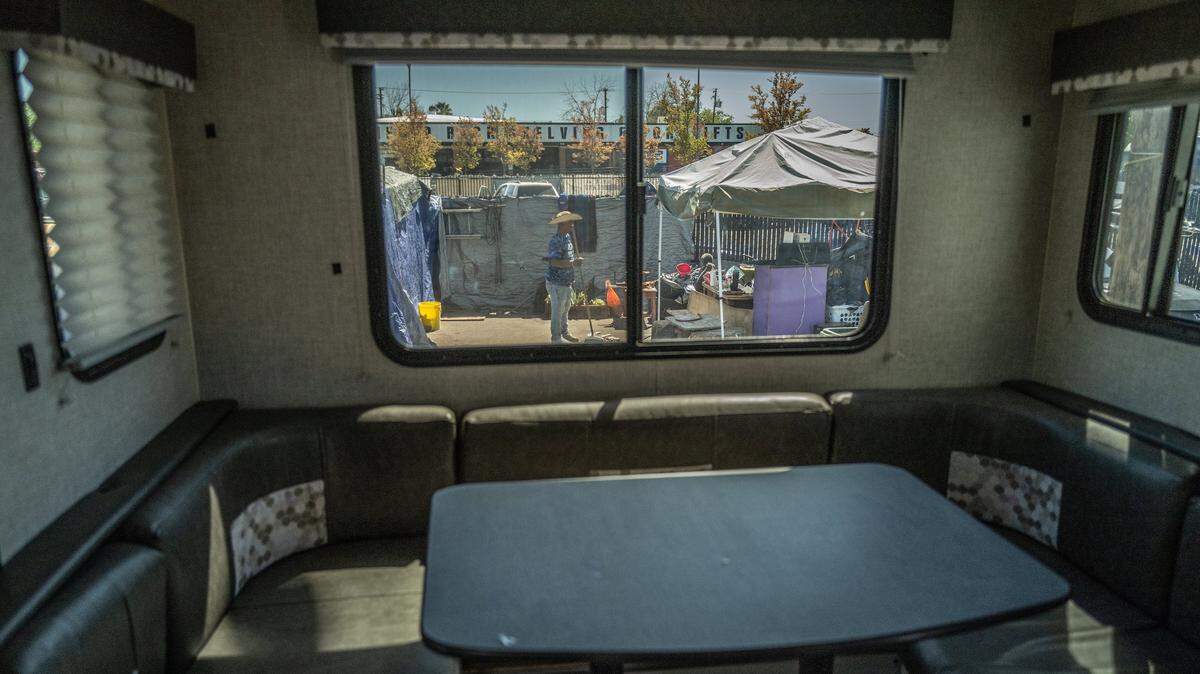 A view through the window of a city-owned travel trailer that was delivered April 10, 2023, to the Camp Resolution homeless encampment in North Sacramento. Sacramento residents joined Mayor Darrell Steinberg and former Stockton Mayor Michael Tubbs for a discussion on ending California poverty last Friday at the Hagginwood Community Center.