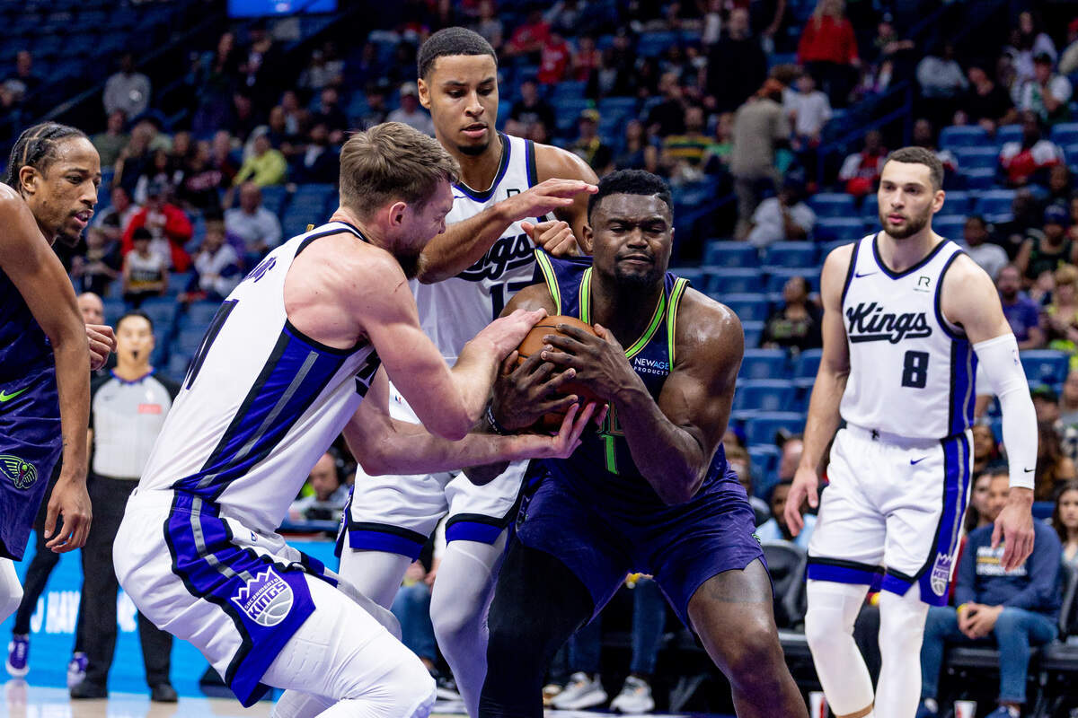 New Orleans Pelicans forward Zion Williamson (1) takes a rebounds from Sacramento Kings forward Domantas Sabonis (11) during the second half Wednesday, Feb. 12, 2025, at Smoothie King Center in New Orleans, Louisiana.