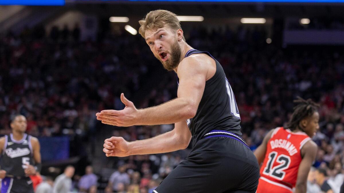 Sacramento Kings forward Domantas Sabonis (10) reacts to no fouled called for forward Harrison Barnes (40) during the fourth quarter on Monday, March 14, 2022 during an NBA basketball game at the Golden 1 Center in Sacramento. The Kings defeated the Bulls 112-103.