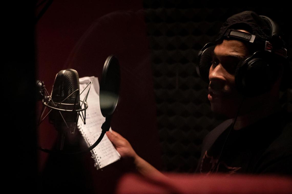 Bay Area artist Parrish “Cousin P” Grayson records the tracks from his latest album in the sound booth at Sacramento recording studio Omina Laboratories on Friday, July 3, 2020.