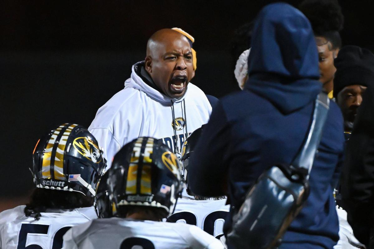 Inderkum Tigers coach Reggie Harris shouts instructions to his team during a timeout in the second half of a 2023 CIF Sac-Joaquin Division I football quarterfinal.