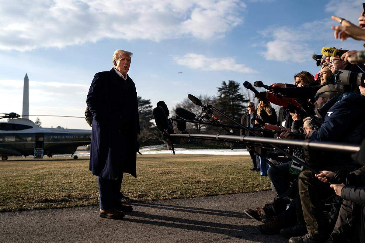 President Donald Trump speaks to members of the press as he and first lady Melania Trump prepare to depart the White House aboard Marine One on Jan. 24, 2025, in Washington, D.C.