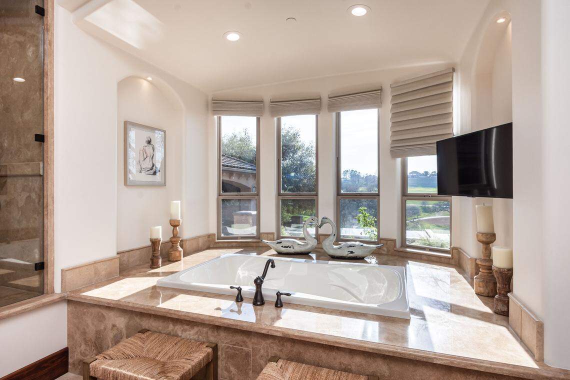 The single-story layout extends throughout the home. The primary suite is no exception.