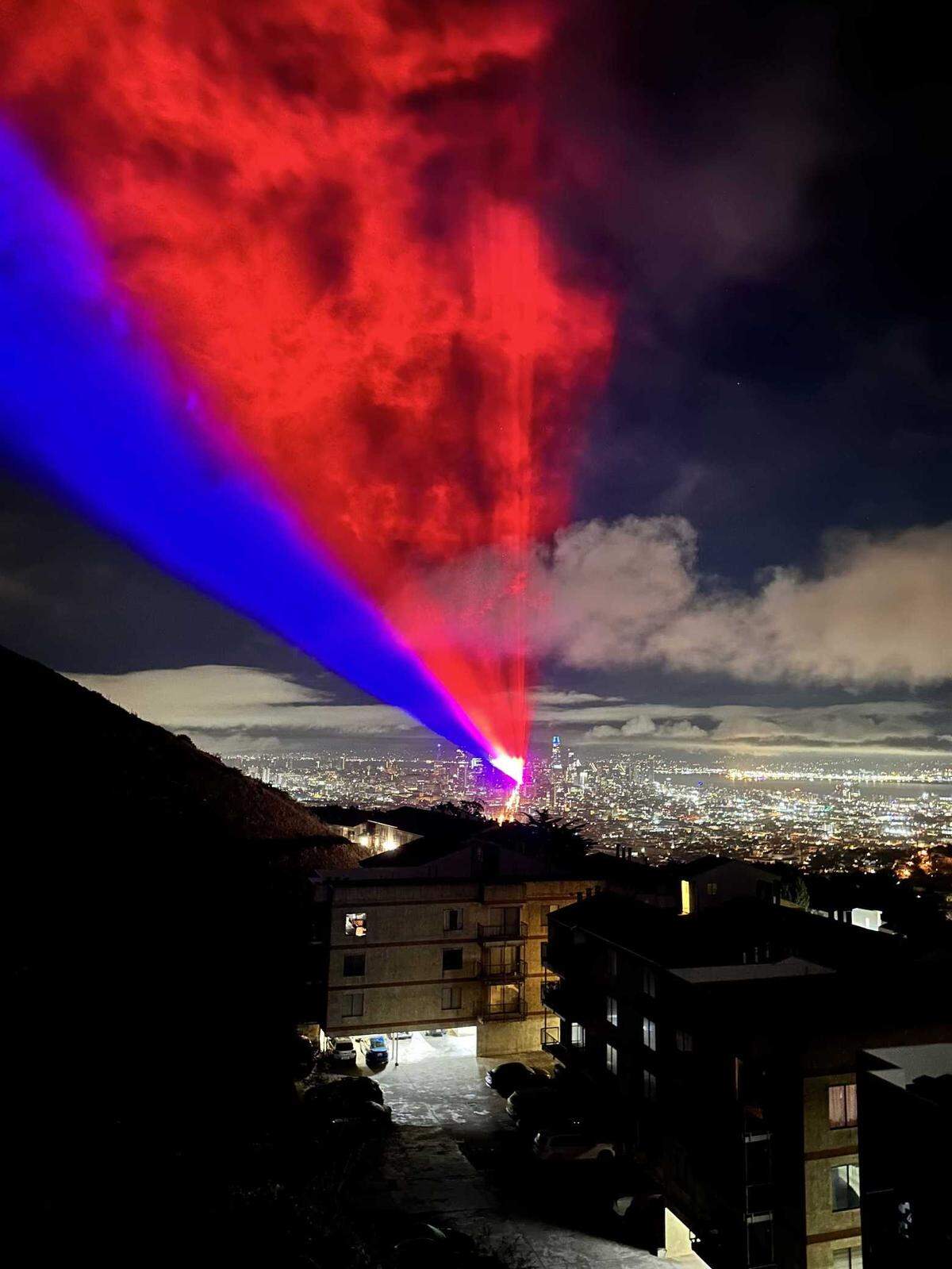 Red and blue beams of light are cast over San Francisco from downtown as part of a weeklong light show for the APEC summit. Nu-Salt Laser Light Shows International of Folsom partnered with Illuminate SF to create a weeklong light show for the APEC summit.