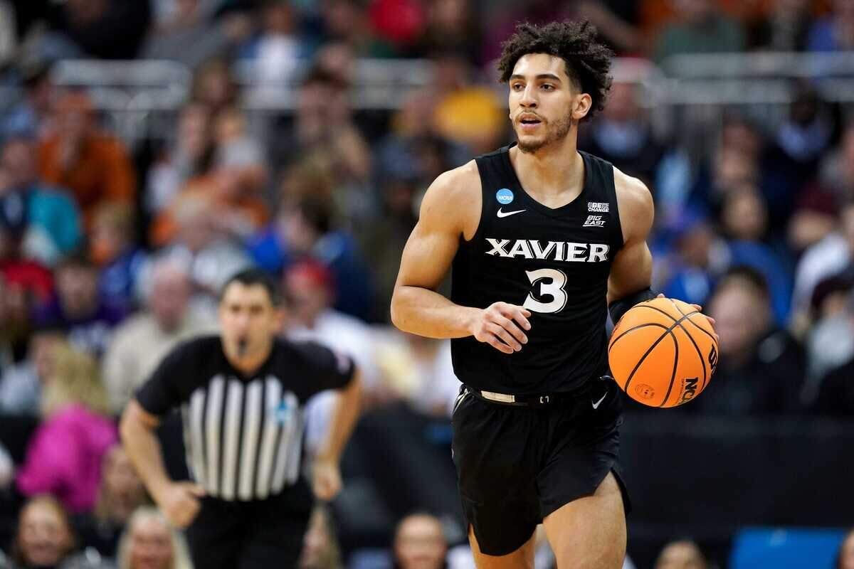 Xavier Musketeers guard Colby Jones (3) brings the ball upcourt during the first half of a Sweet 16 college basketball game between the Xavier Musketeers and the Texas Longhorns in the Midwest Regional of the NCAA Tournament, Friday, March 24, 2023, at T-Mobile Center in Kansas City, Mo.