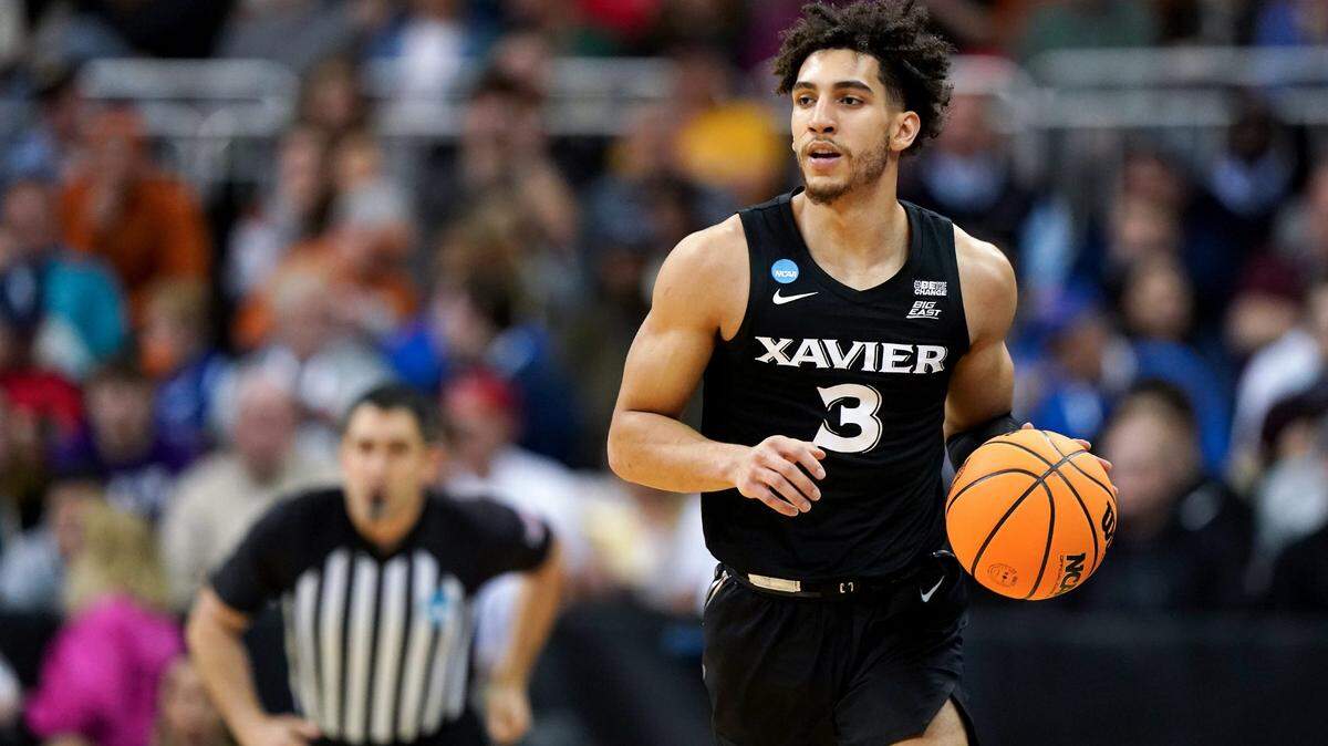 Xavier Musketeers guard Colby Jones (3) brings the ball upcourt during the first half of a Sweet 16 college basketball game between the Xavier Musketeers and the Texas Longhorns in the Midwest Regional of the NCAA Tournament, Friday, March 24, 2023, at T-Mobile Center in Kansas City, Mo.